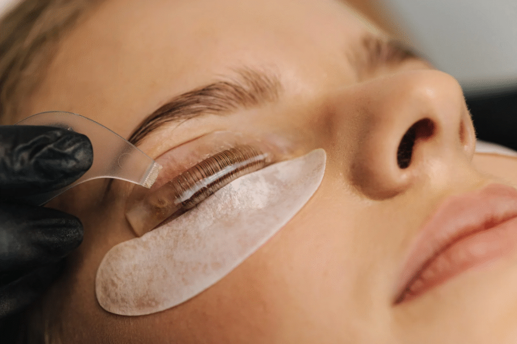 canva_lashlift woman receiving lash lift and tint services in newport beach