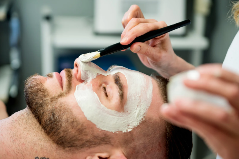 canva_man_facial man receiving a gentleman's glow facial treatment in newport beach